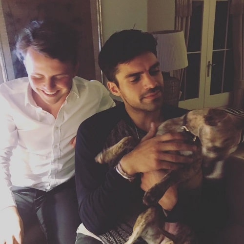 A picture of Sean Teale with his dog and a friend.